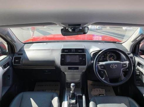 RED Toyota Land Cruiser Prado Price in Japan (2026): Import Costs, Features, Specs & Buying Guide