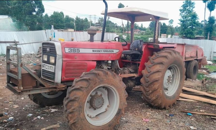 Massey Ferguson 385 4wd + 8 ton trailer photo